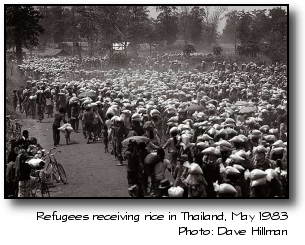 Refugees carrying rice in a Thai refugee camp, 1983. Photo by Dave Hillman.