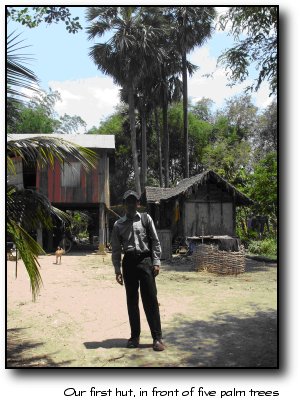 Our first hut, in front of five palm trees